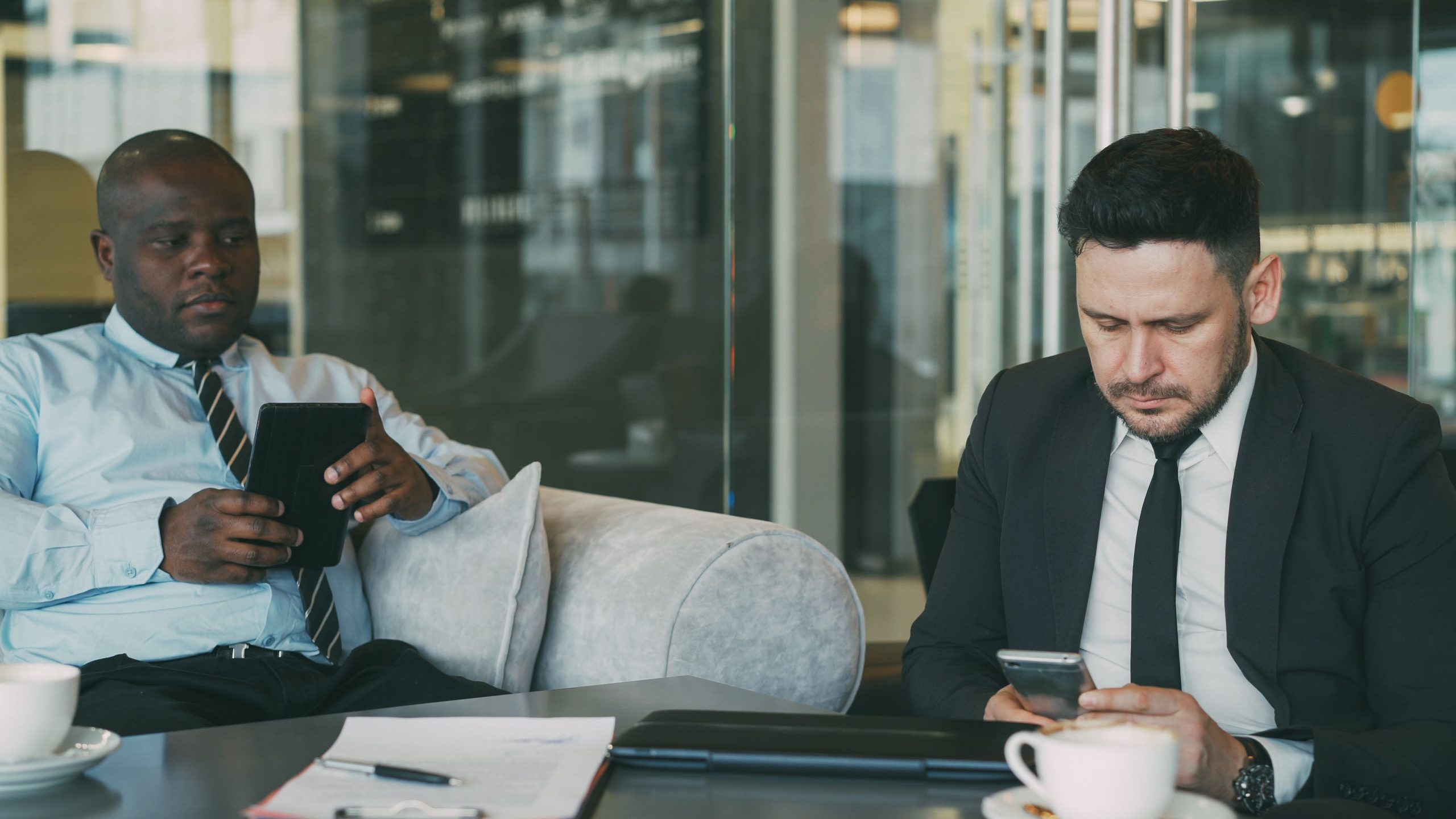 Laptop, tablet and smartphone connected in a modern workplace.